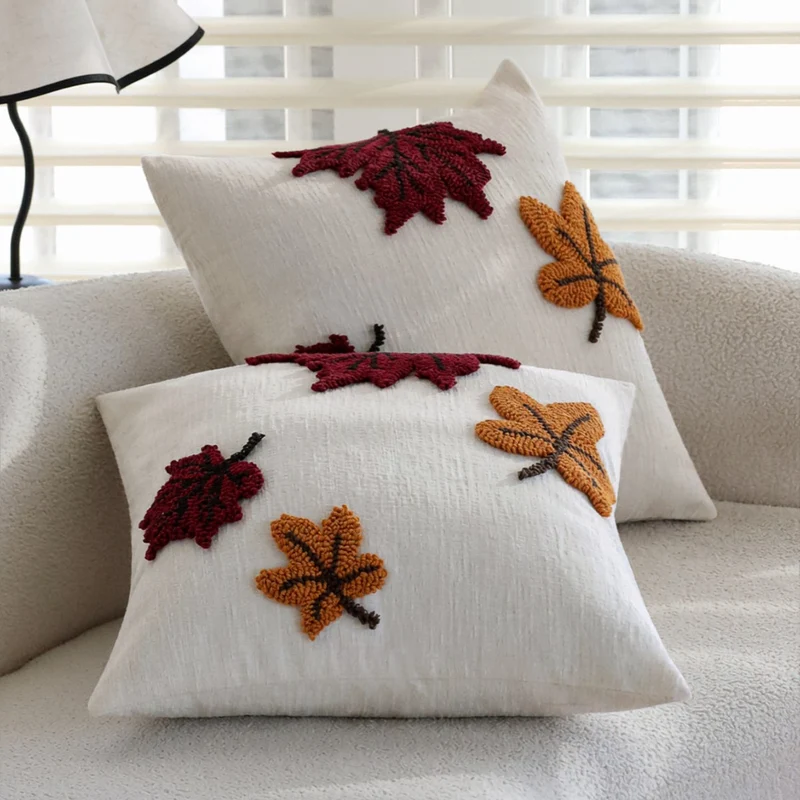 Square cushion cover with hand-tufted autumn leaf appliqués Stornfield