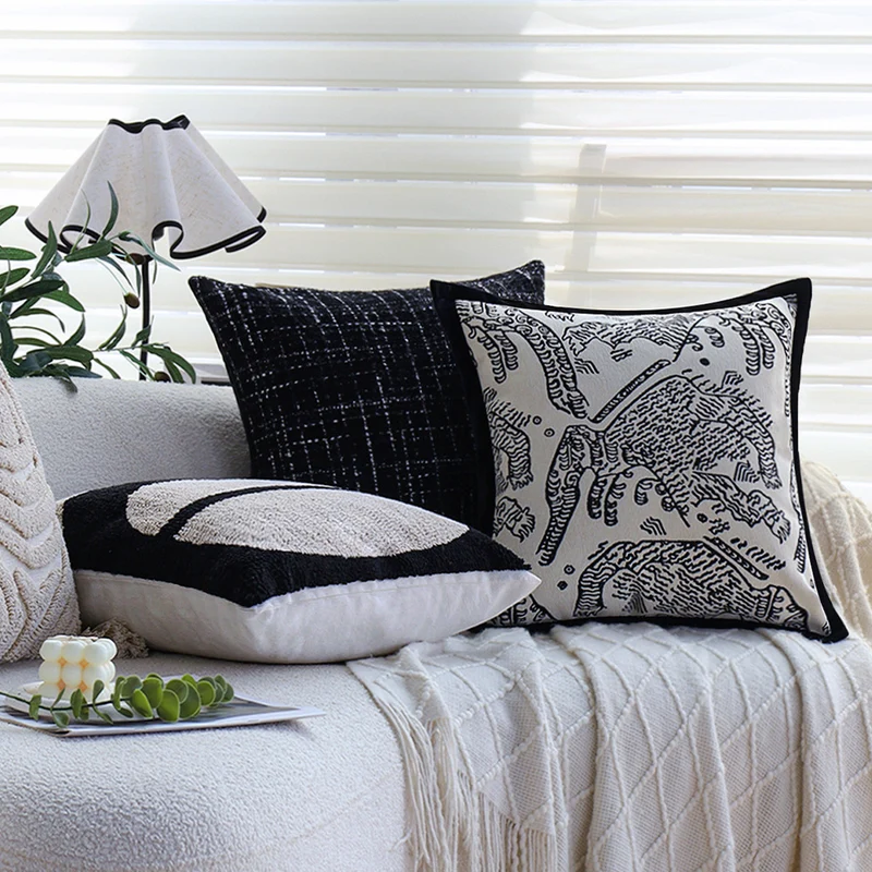 Square decorative cushion cover with hand-tufted geometric relief and corner tassels Stornfield