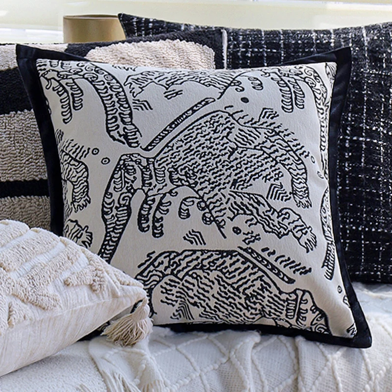 Square decorative cushion cover with hand-tufted geometric relief and corner tassels Stornfield