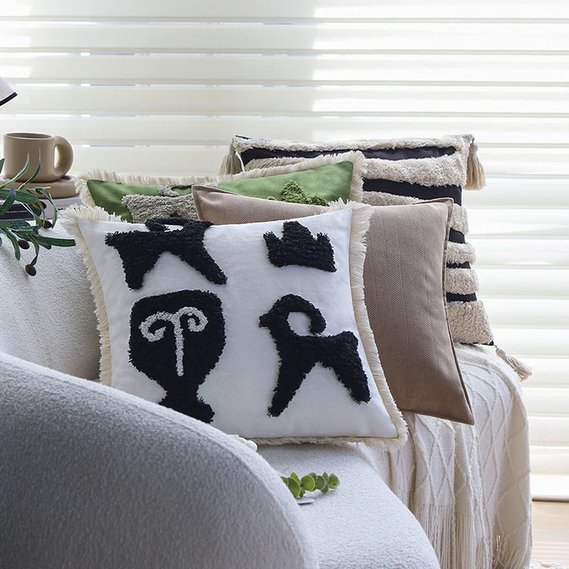 Square decorative cushion cover with hand-tufted ethnic appliqué motif and fringed edge Stornfield