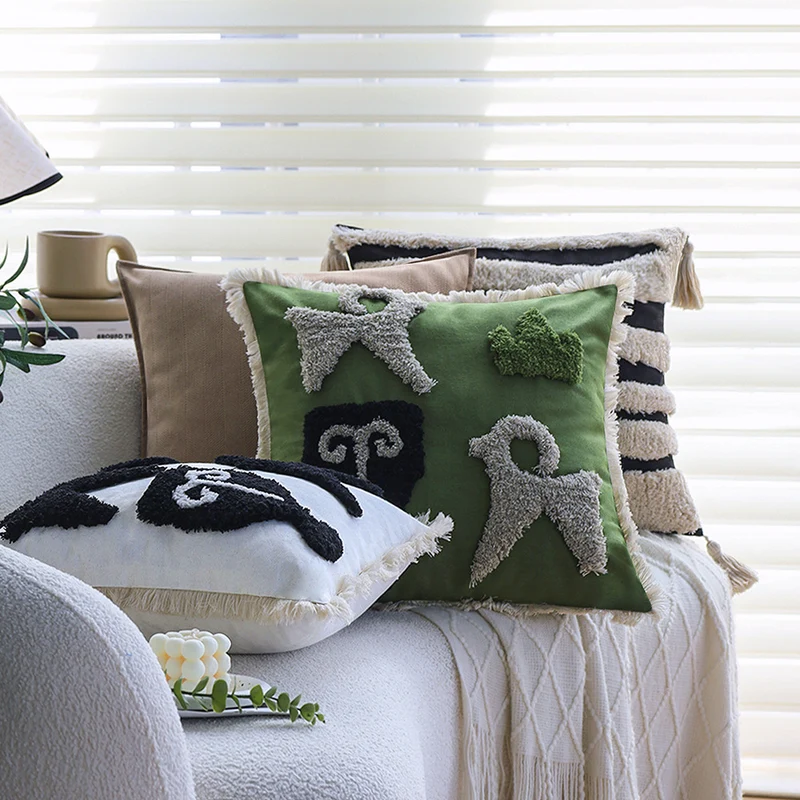Square decorative cushion cover with hand-tufted ethnic appliqué motif and fringed edge Stornfield