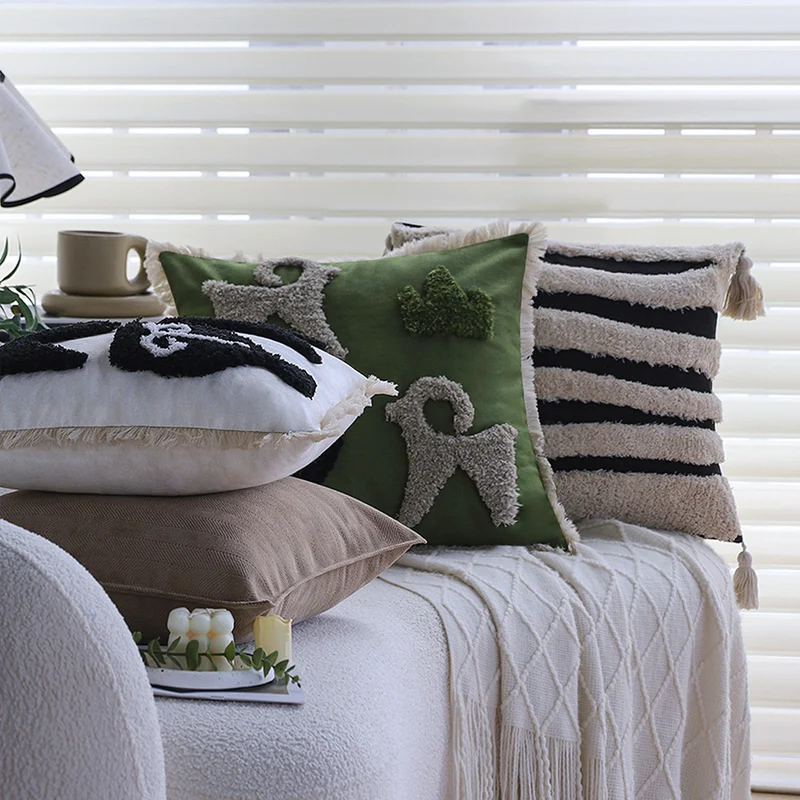 Square decorative cushion cover with hand-tufted ethnic appliqué motif and fringed edge Stornfield