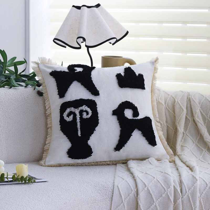 Square decorative cushion cover with hand-tufted ethnic appliqué motif and fringed edge Stornfield