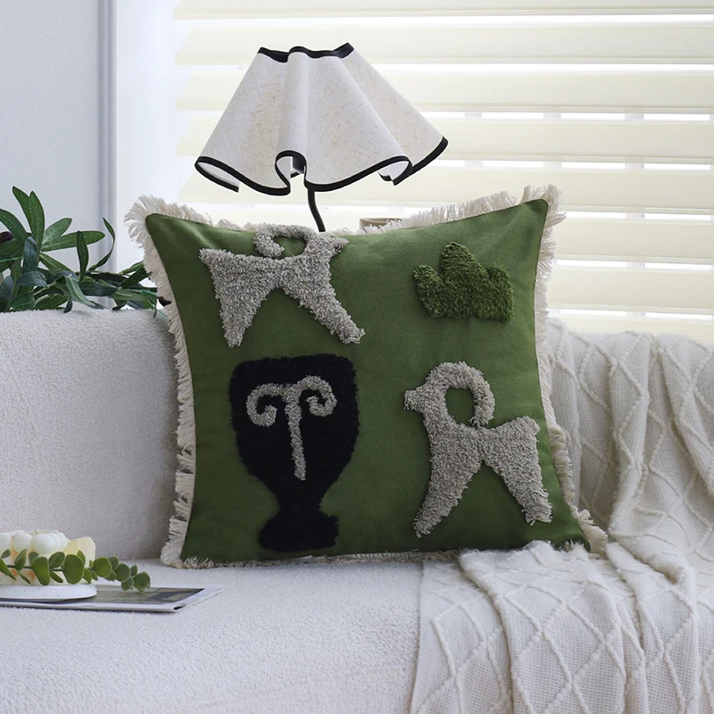 Square decorative cushion cover with hand-tufted ethnic appliqué motif and fringed edge Stornfield