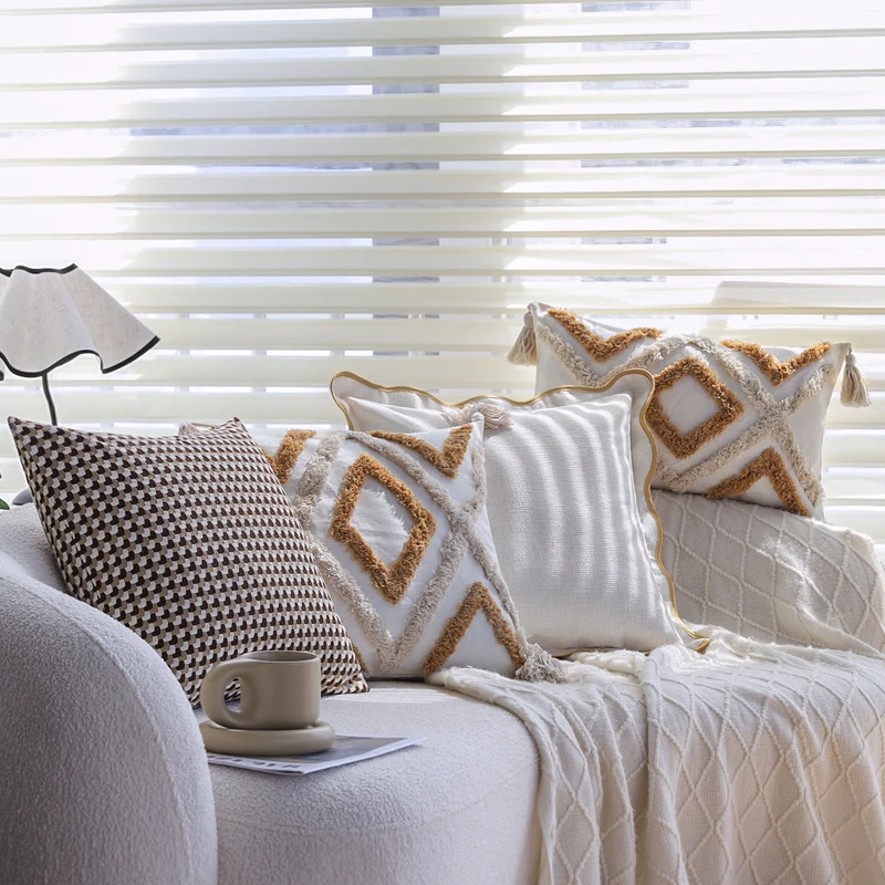 Square decorative cushion cover with hand-tufted diamond-loop relief, corner tassels, and cotton-linen mix Stornfield