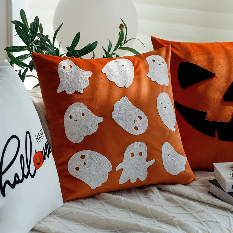 Square decorative cushion cover with Halloween pumpkin face tuft appliqué made of velvet Stornfield
