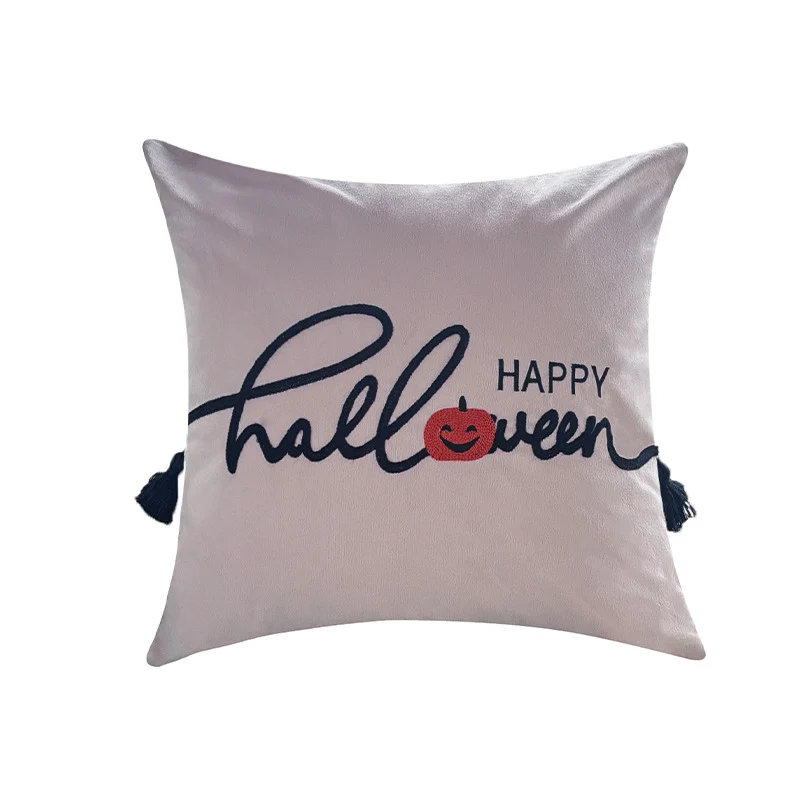 Square decorative cushion cover with embroidered Happy Halloween lettering, pumpkin appliqué, and tassels Stornfield