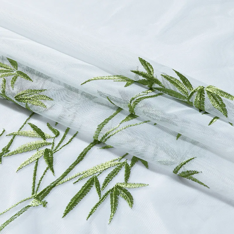 Curtain with eyelets made of semi-transparent voile, embroidered bamboo motif and hemmed decorative edge Stornfield
