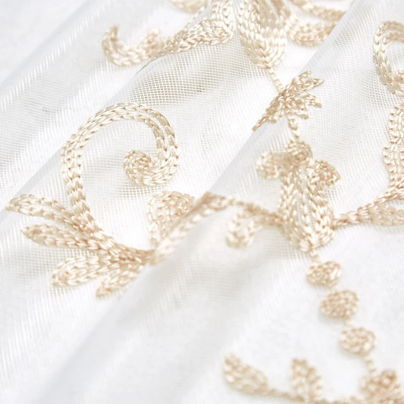 Finer embroidered voile curtain fabric with floral jacquard Stornfield