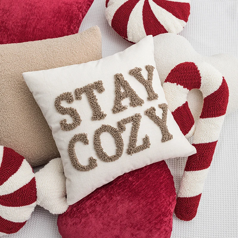Decorative square cushion cover with hand-tufted lettering made of Bouclé Stornfield