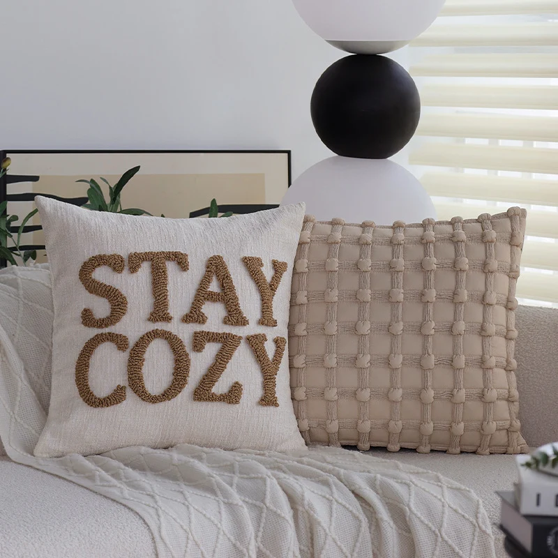 Decorative cushion cover with tufted lettering and textured cotton-linen blend Stornfield