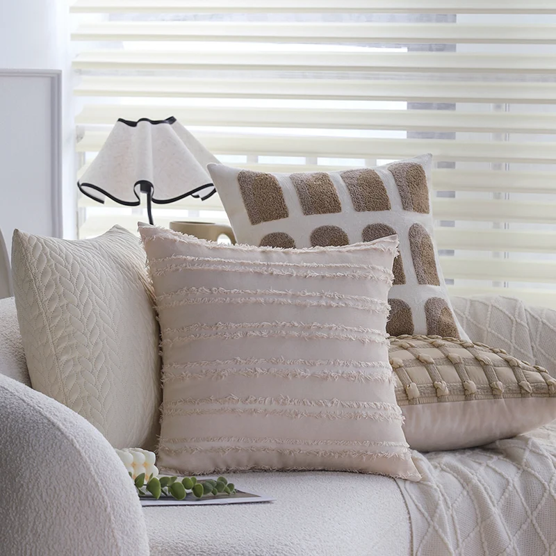 Decorative cushion cover with knotted grid structure and fine woven applications Stornfield