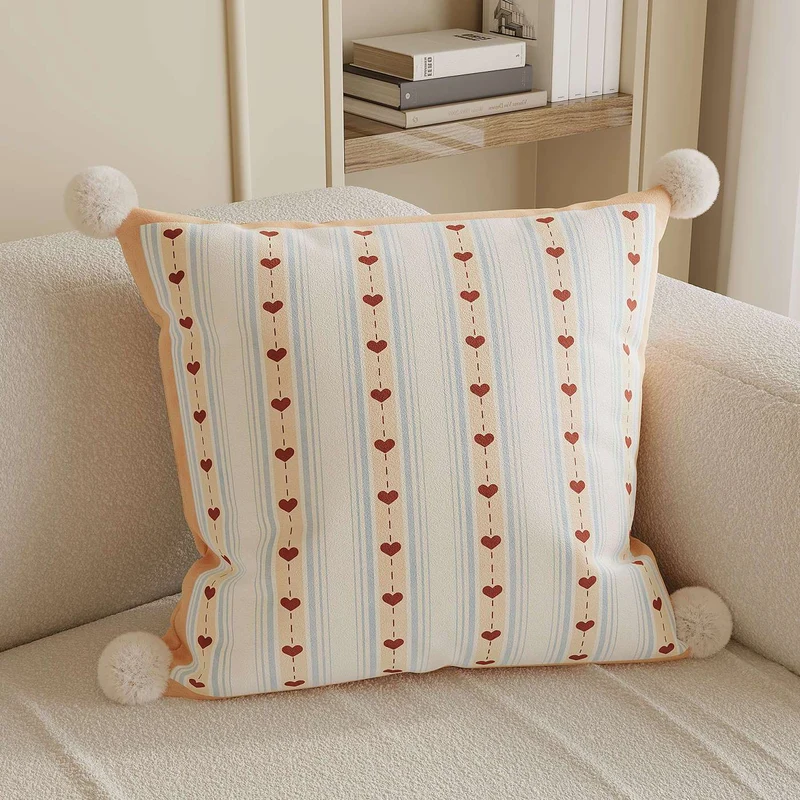 Decorative Throw Pillow with Pom-Pom Corners and Heart Stripe Print