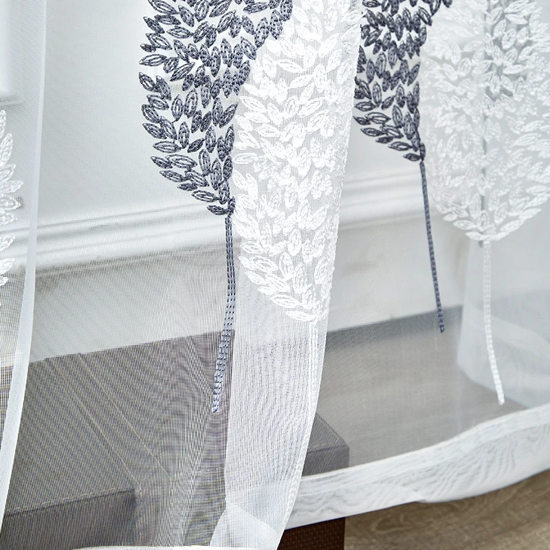 Transparent voile curtain with embroidered leaf pattern and eyelet suspension Stornfield