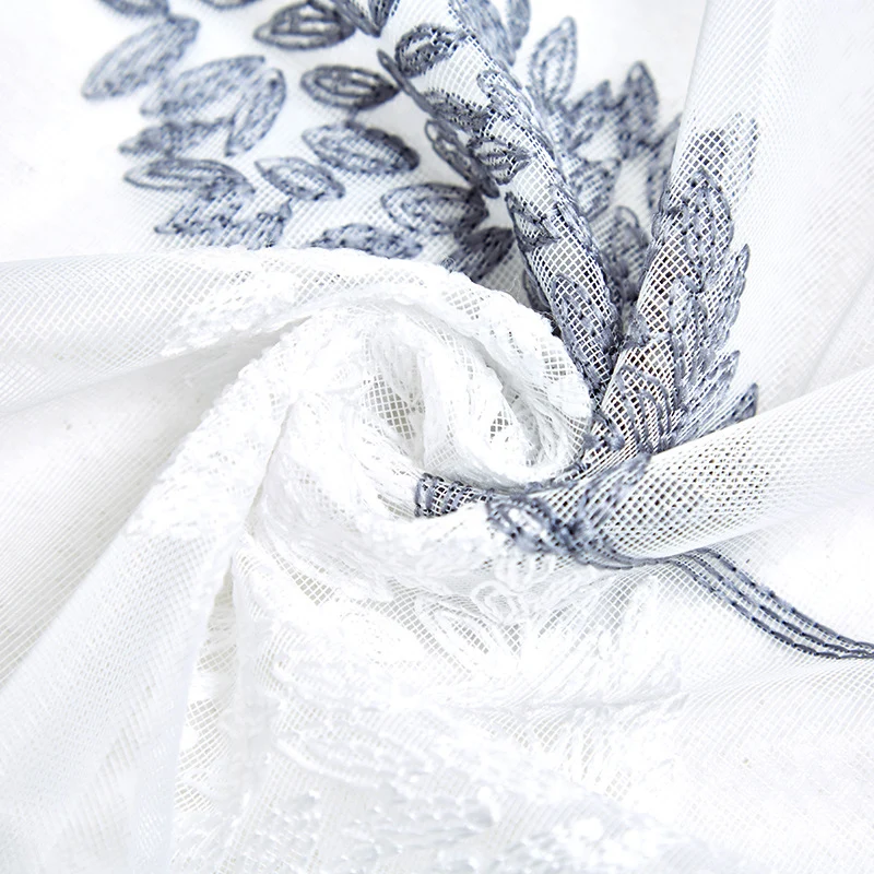 Transparent voile curtain with embroidered leaf pattern and eyelet suspension Stornfield