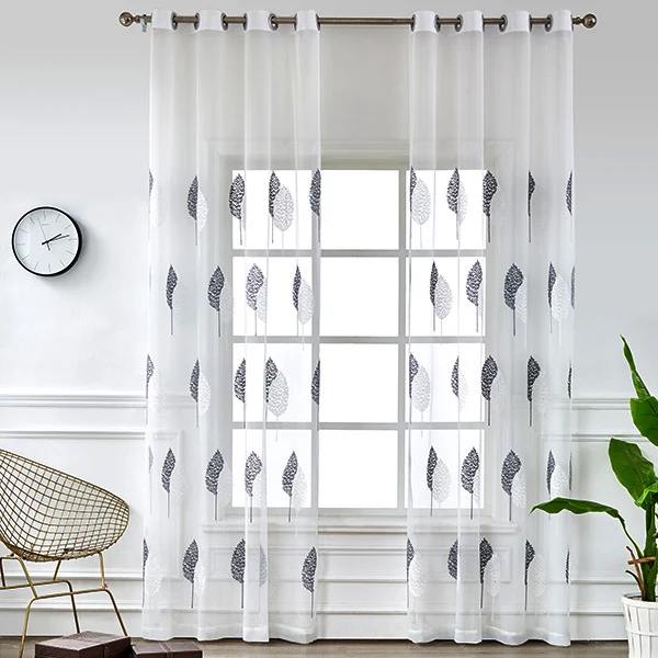 Transparent voile curtain with embroidered leaf pattern and eyelet suspension Stornfield