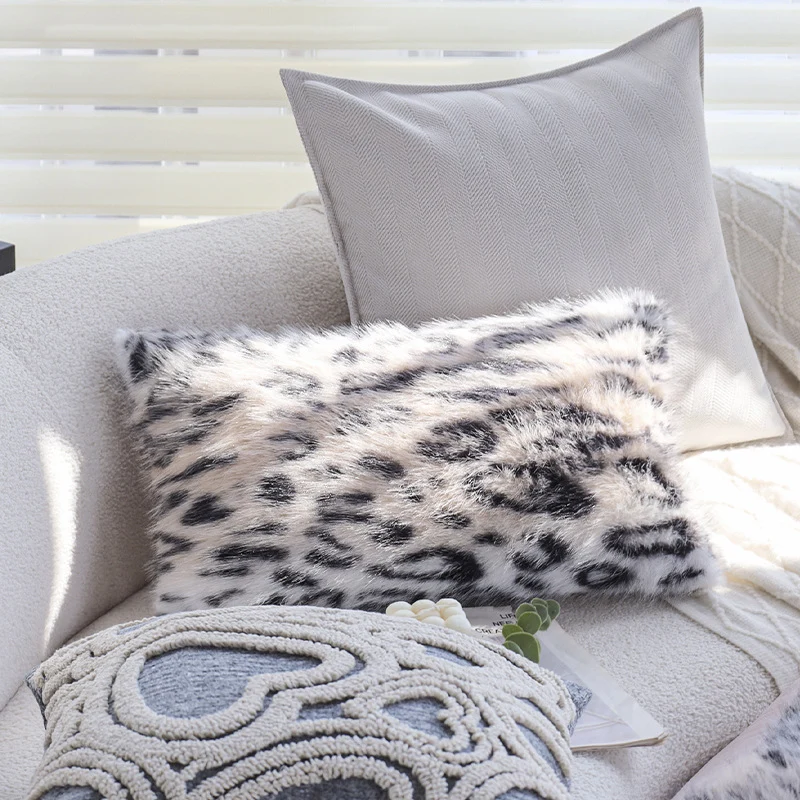 Set of square cushion covers with faux fur leopard pattern and woven herringbone look Stornfield