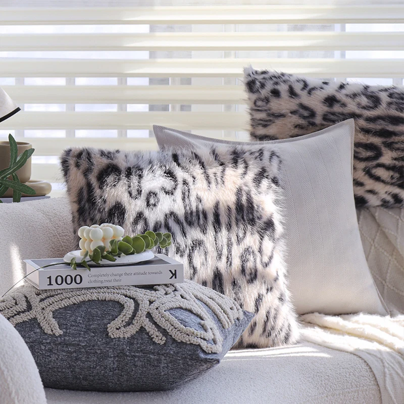 Set of square cushion covers with faux fur leopard pattern and woven herringbone look Stornfield