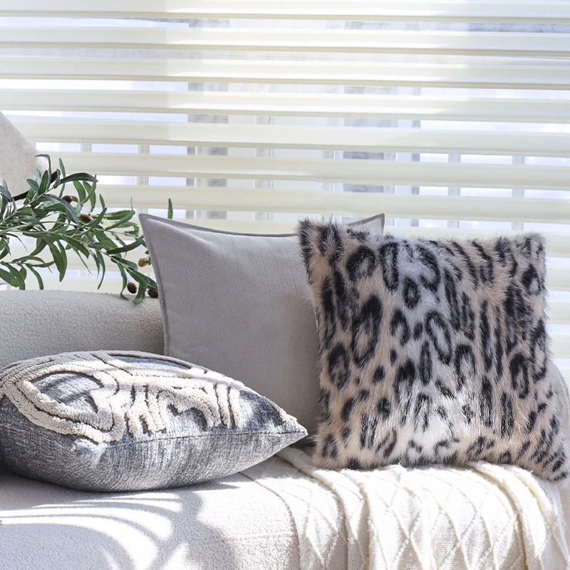 Set of square cushion covers with faux fur leopard pattern and woven herringbone look Stornfield