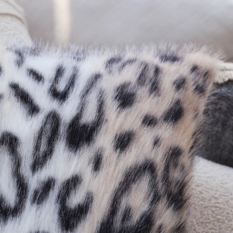 Set of square cushion covers with faux fur leopard pattern and woven herringbone look Stornfield