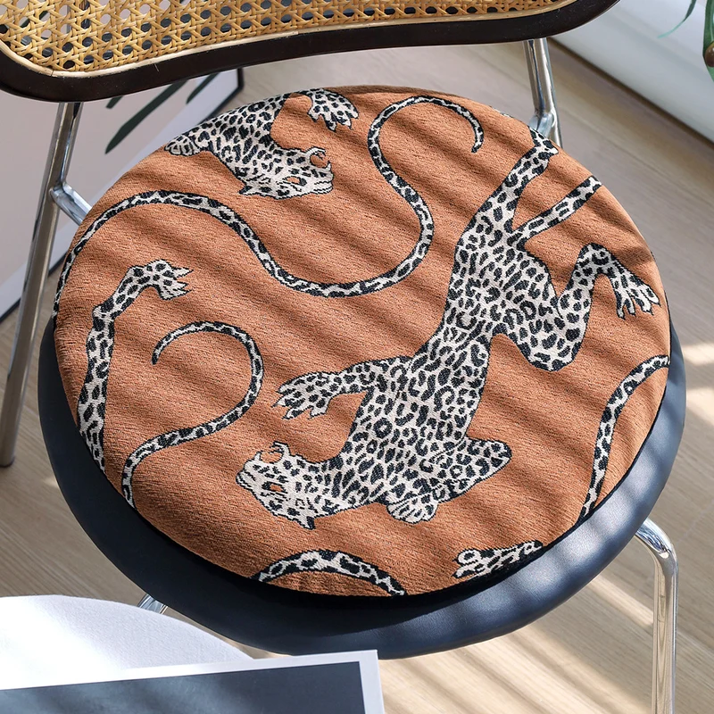 Round seat cushion with jacquard leopard design, thick padding and non-slip underside Stornfield
