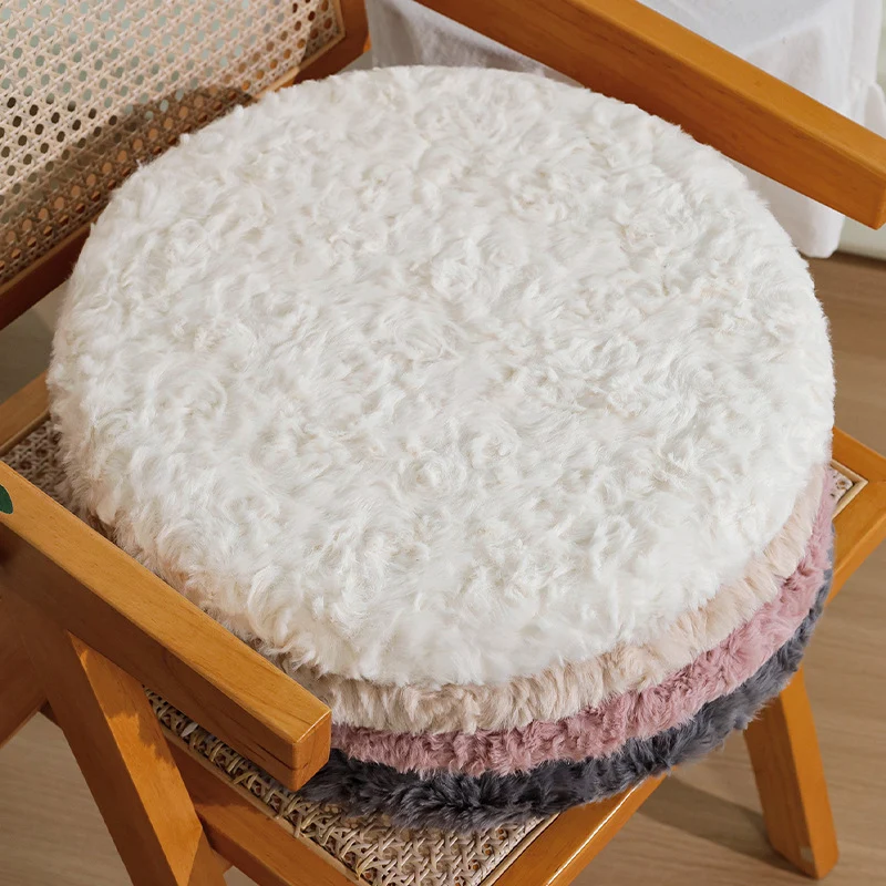 Round seat cushion made of dense artificial fur with comfortable padding and anti-slip base Stornfield