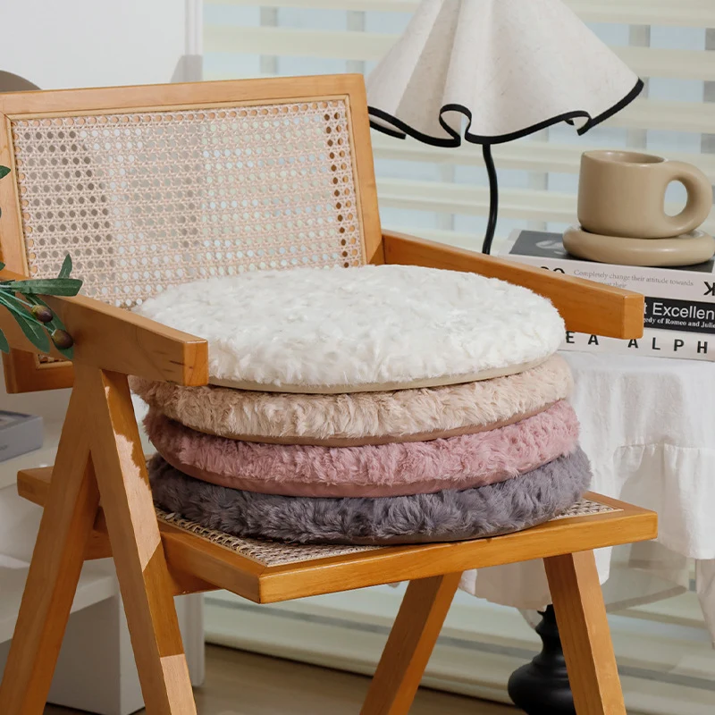 Round seat cushion made of dense artificial fur with comfortable padding and anti-slip base Stornfield