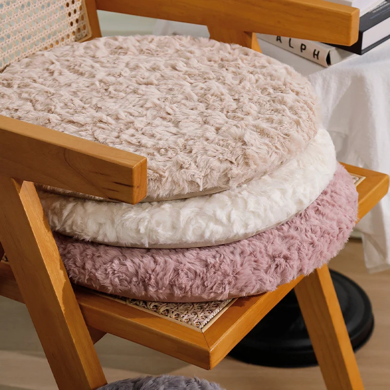 Round seat cushion made of dense artificial fur with comfortable padding and anti-slip base Stornfield