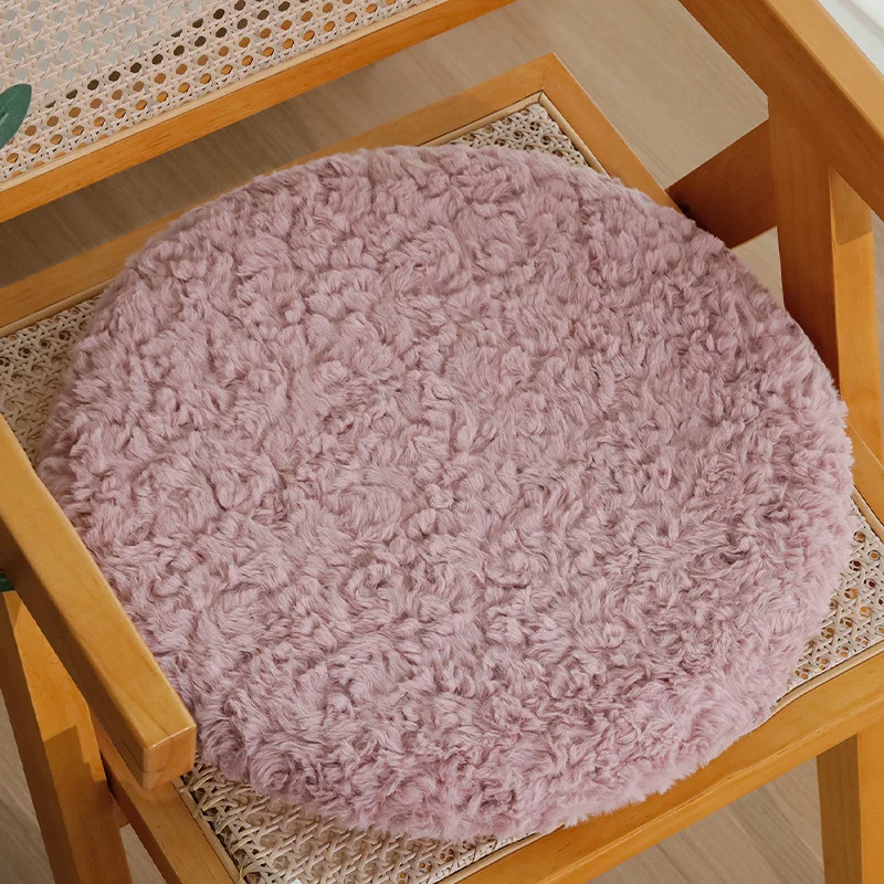 Round seat cushion made of dense artificial fur with comfortable padding and anti-slip base Stornfield