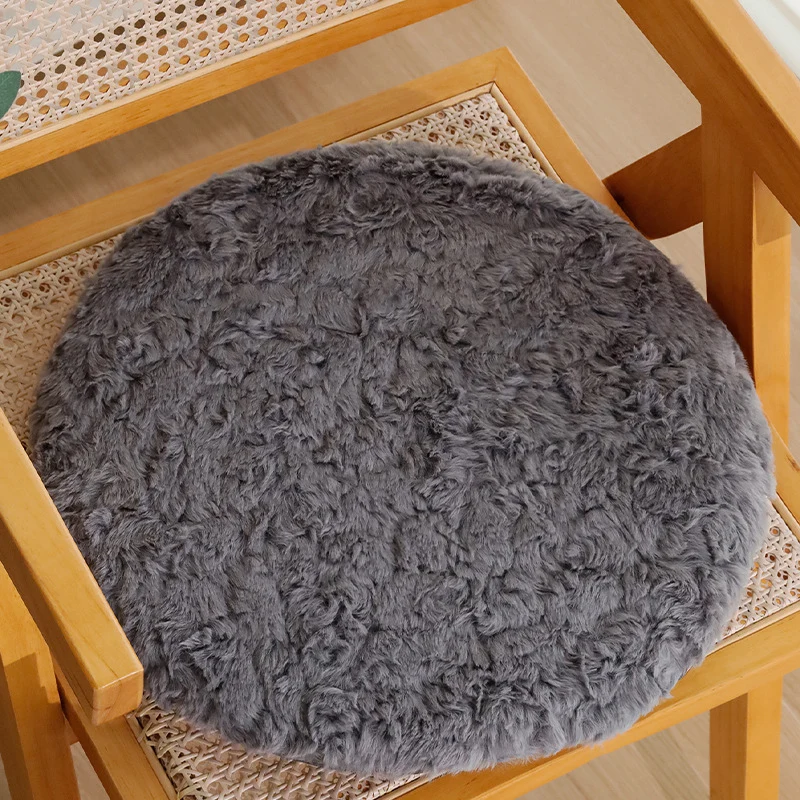 Round seat cushion made of dense artificial fur with comfortable padding and anti-slip base Stornfield