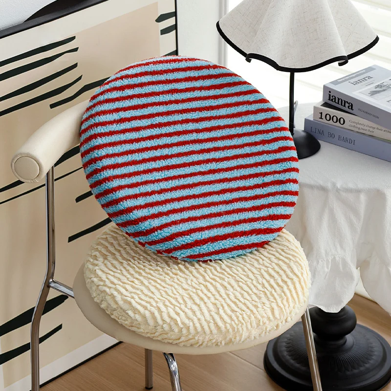 Round padded seat cushion made of soft chenille with striped texture Stornfield