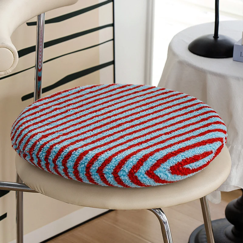 Round padded seat cushion made of soft chenille with striped texture Stornfield