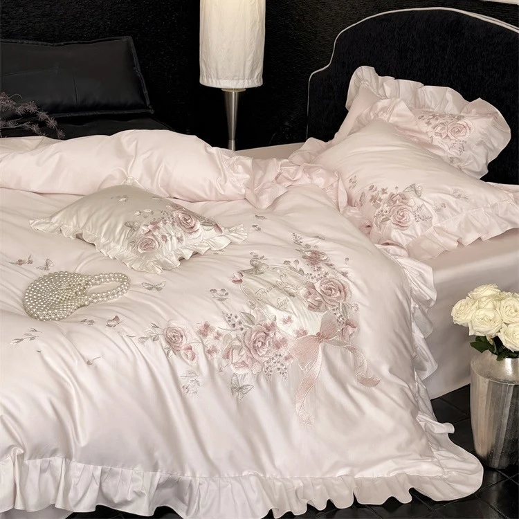Luxurious satin bedding set with floral embroidery, ruffled edge and silky-matte finish Stornfield