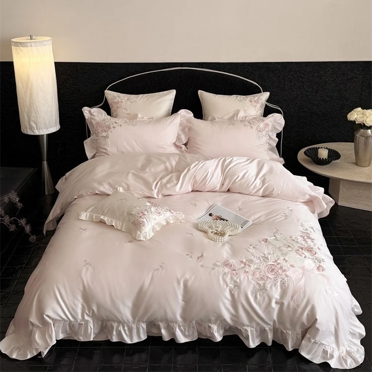 Luxurious satin bedding set with floral embroidery, ruffled edge and silky-matte finish Stornfield