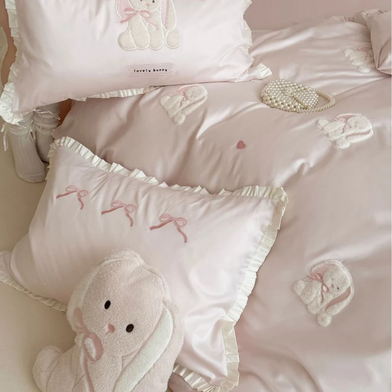 Luxurious cotton satin bedding set with embroidered bunnies and ruffled pillow Stornfield