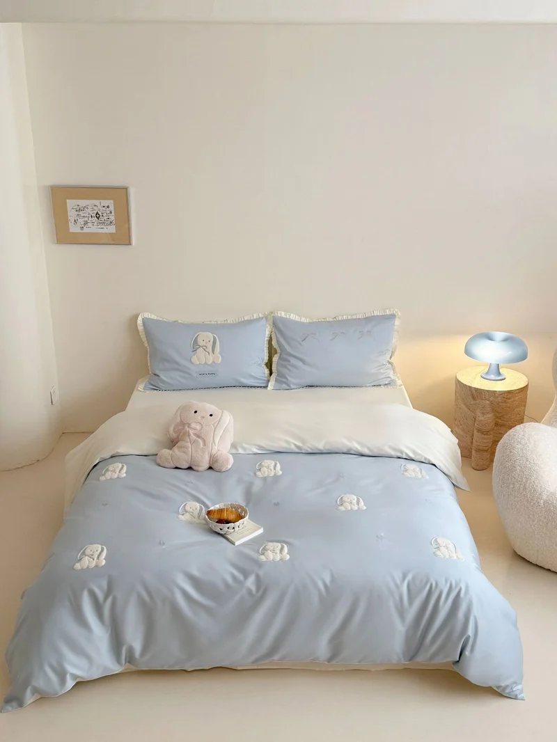 Luxurious cotton satin bedding set with embroidered bunnies and ruffled pillow Stornfield
