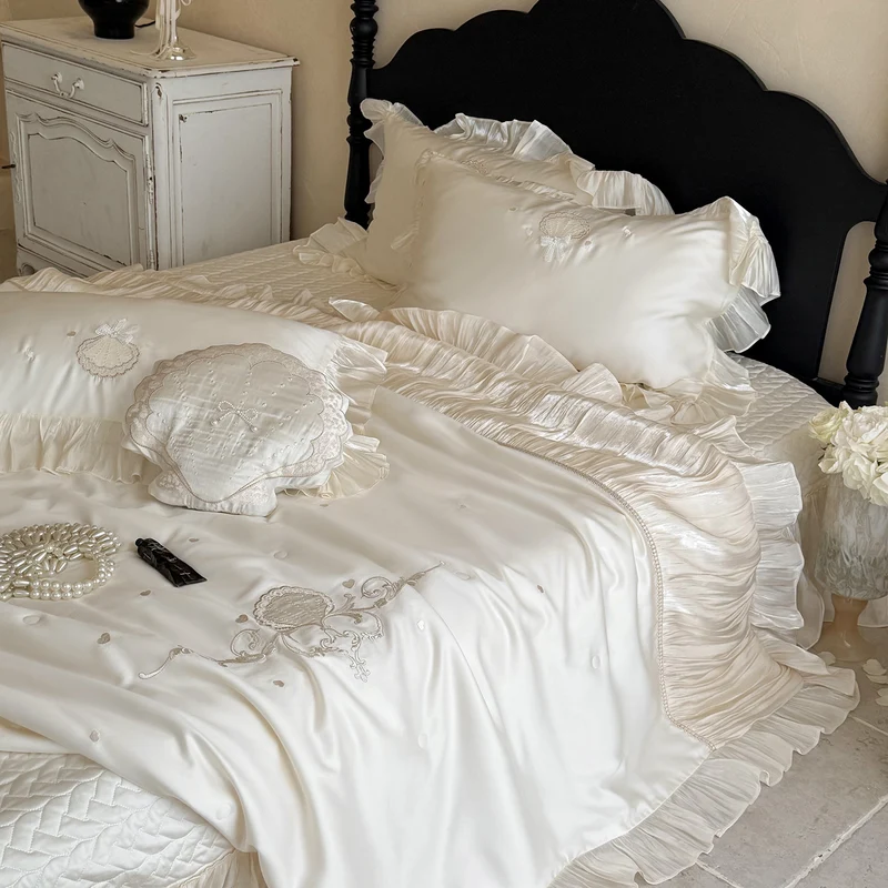 Elegant embroidered satin bedding set with frill pillow and quilted bedspread Stornfield
