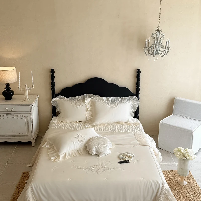 Elegant embroidered satin bedding set with frill pillow and quilted bedspread Stornfield
