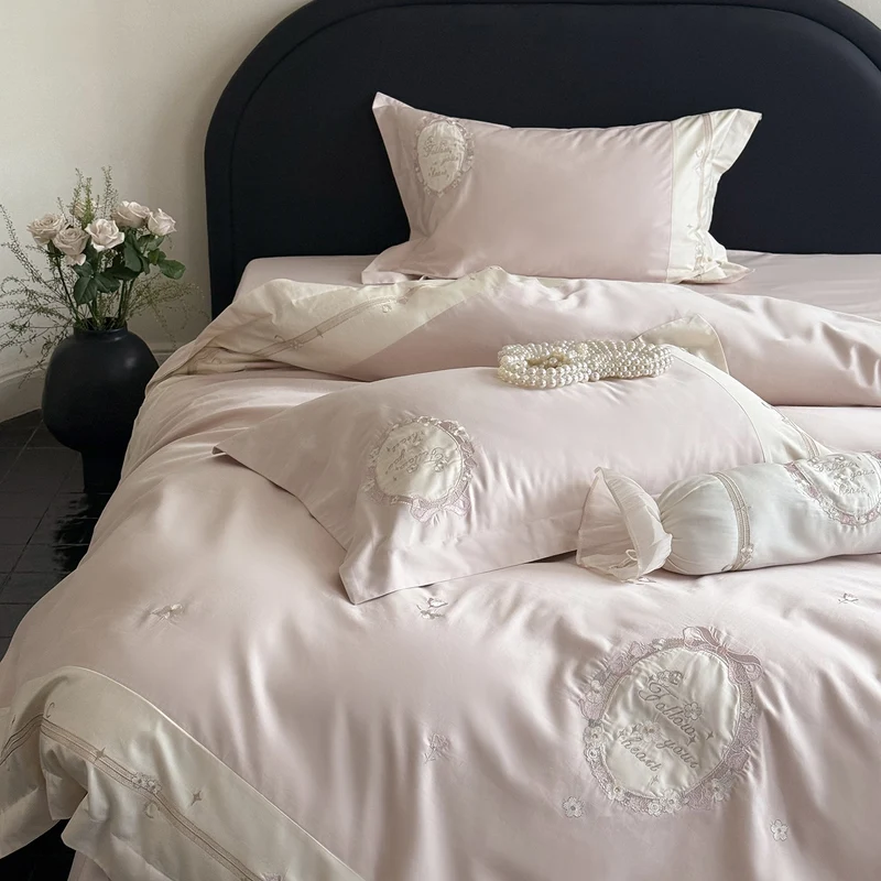 Noble cotton satin bed linen set with delicate rosette embroidery and decorative cushion roll Stornfield