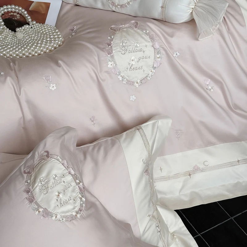 Noble cotton satin bed linen set with delicate rosette embroidery and decorative cushion roll Stornfield