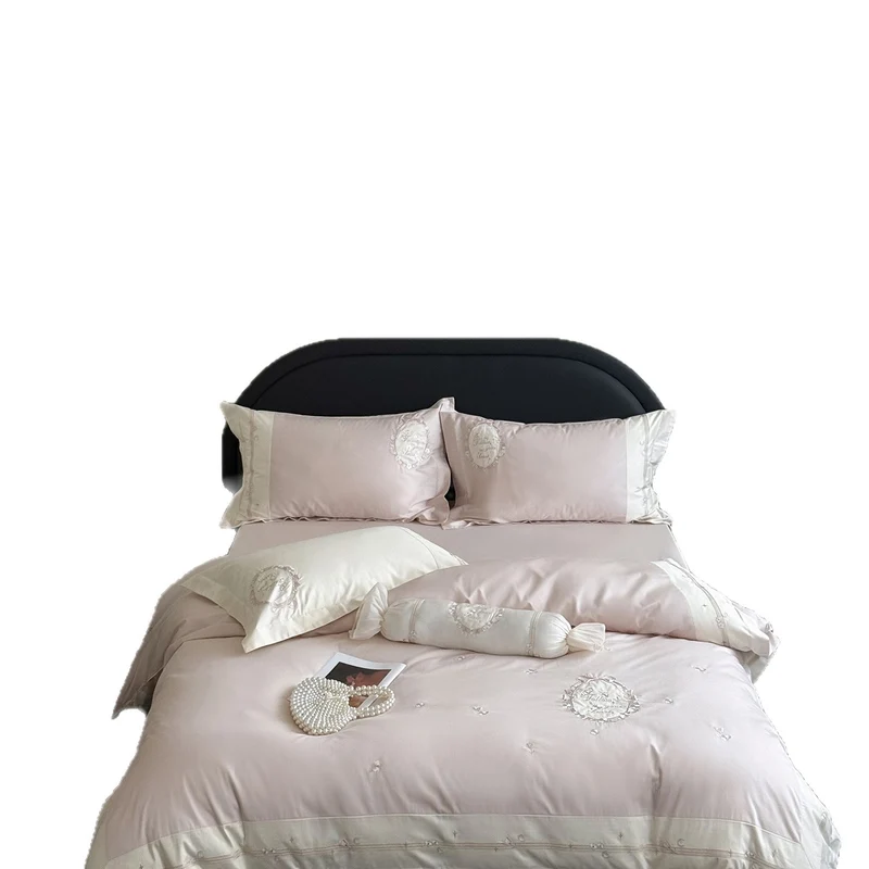 Noble cotton satin bed linen set with delicate rosette embroidery and decorative cushion roll Stornfield