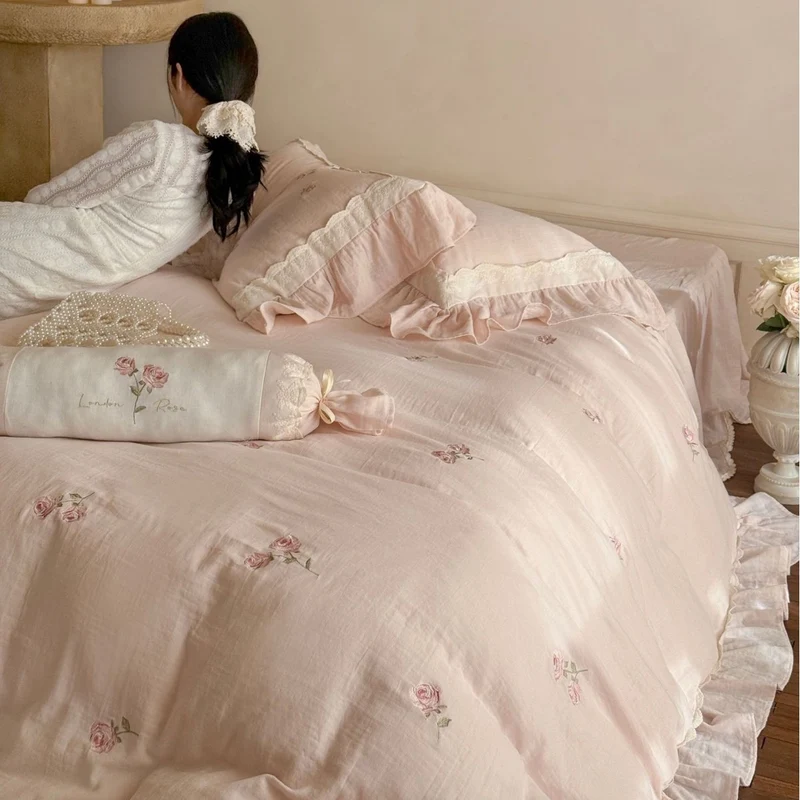 Bedding set with romantic ruffle trim and rose embroidery Stornfield