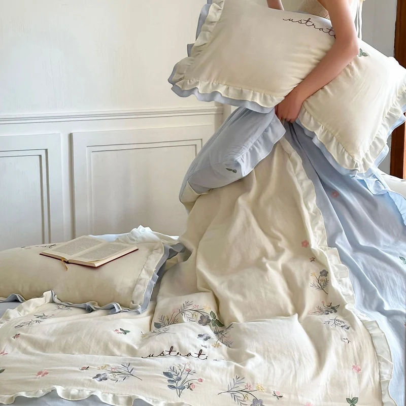 Cotton bedding set in country house style with ruffle edge and fine floral embroidery Stornfield